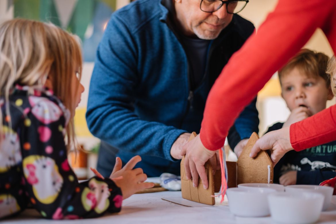 working on gingerbread house with grandkids